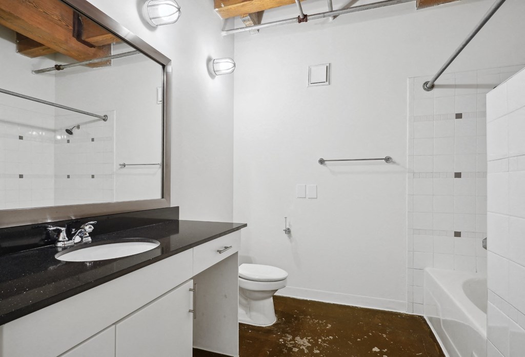 Murray loft spacious bathroom modern vanity and shower | Deep Ellum Lofts in Dallas, TX
