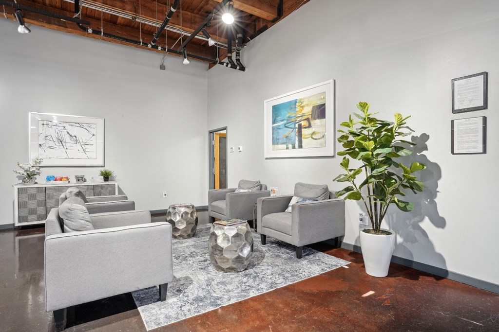 Deep Ellum Lofts leasing office with single seater couches and a snack bar | Deep Ellum Lofts in Dallas, TX