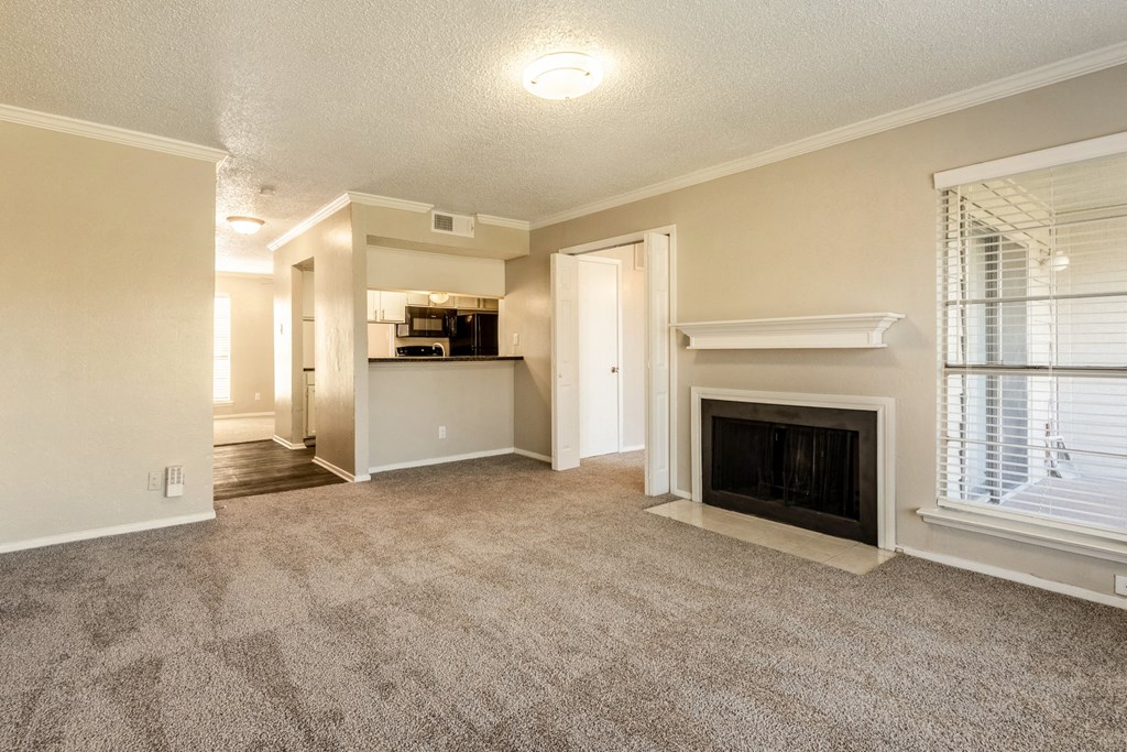 Vacant Living Room with Fireplace at Noel on the Parkway Apartments in Dallas, Texas, TX