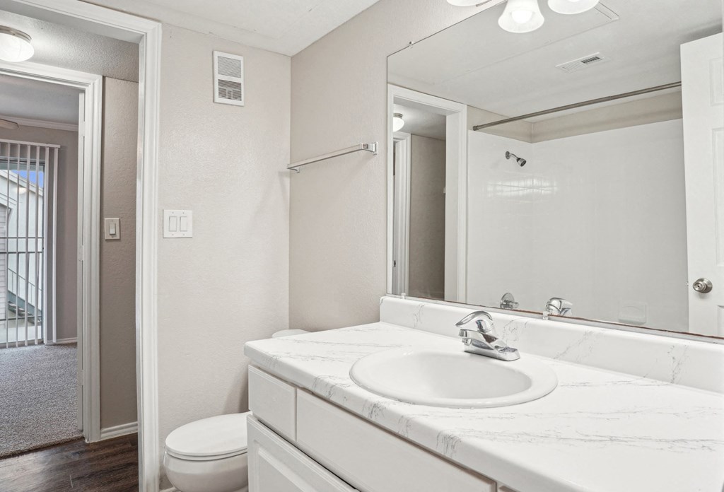 Unfurnished A4 floor plan bathroom with a sink, mirror and a toilet Noel on The Parkway in Dallas, TX