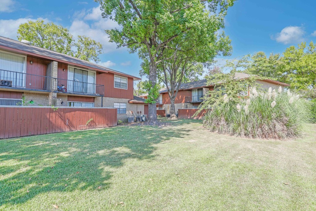 The private outdoor patios and second-floor balconies attached to apartment buildings at Orleans Square in Shreveport, LA