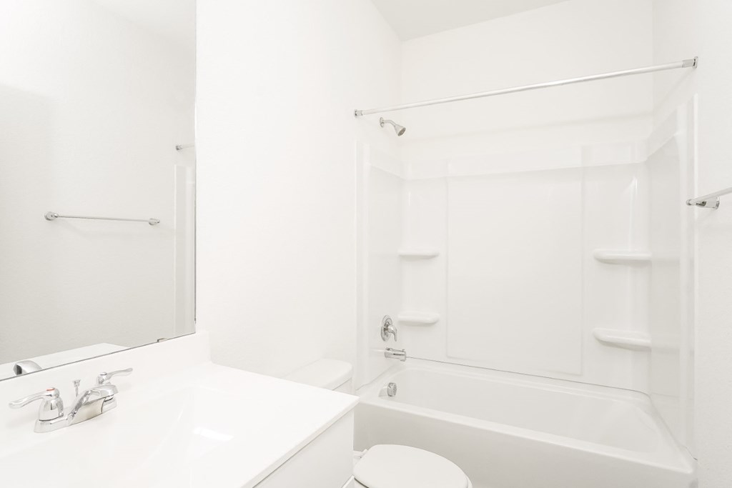 2nd bathroom with a bathtub and a sink at Beacon at Clinton Corners in Dade City, FL