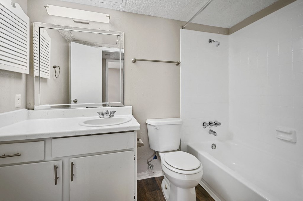 a bathroom with a sink toilet and bathtub