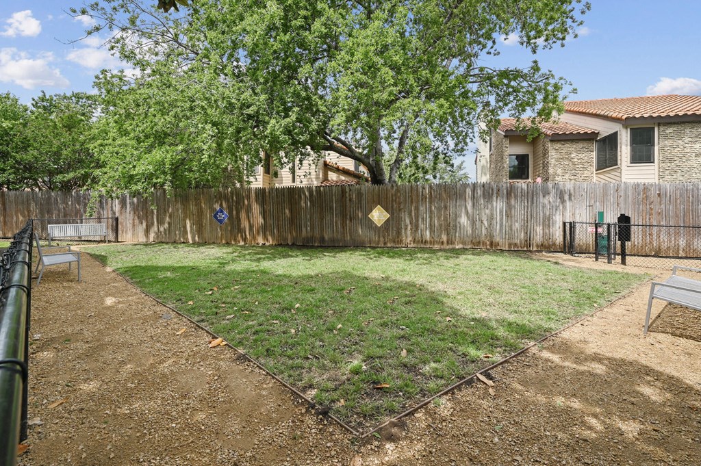 the backyard at the whispering winds apartments in pearland, tx