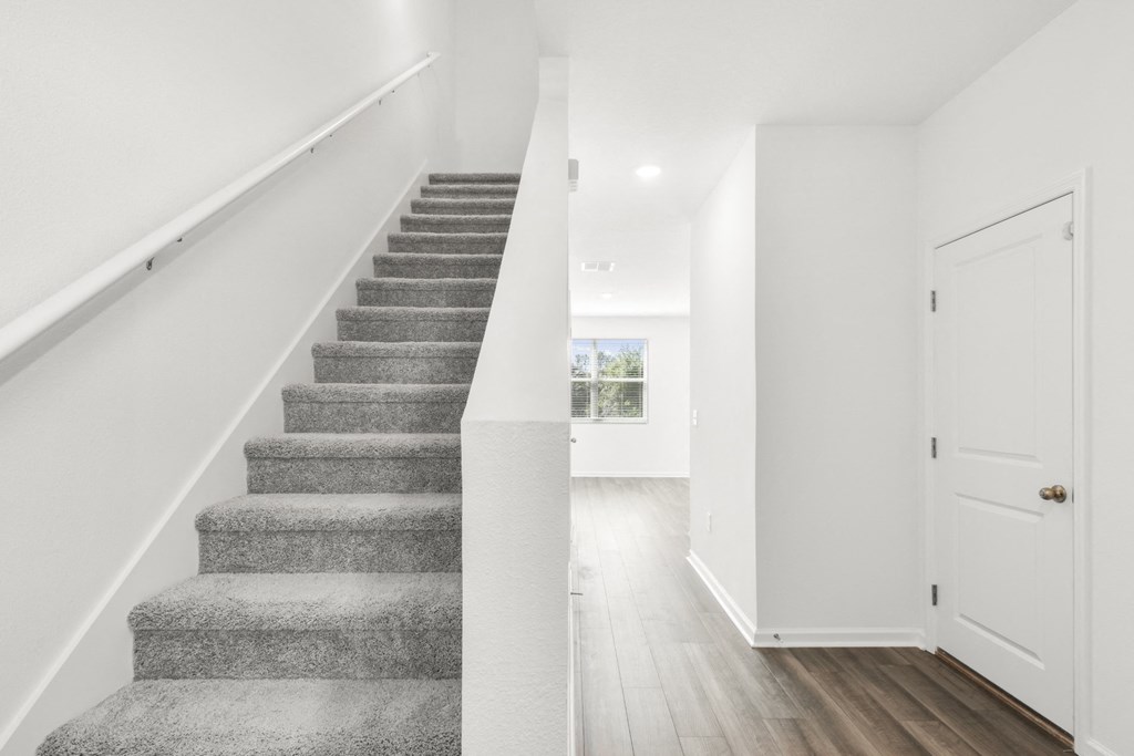 a bedroom with a staircase in a 555 waverly unit