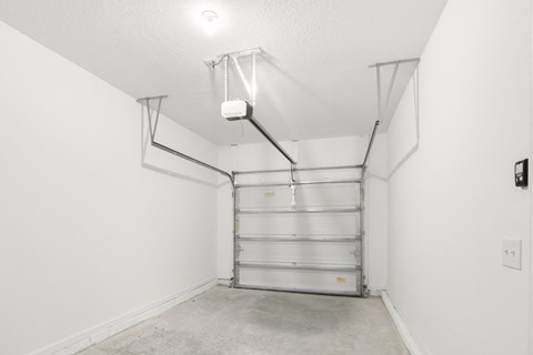 spacious garage with white walls and bright light