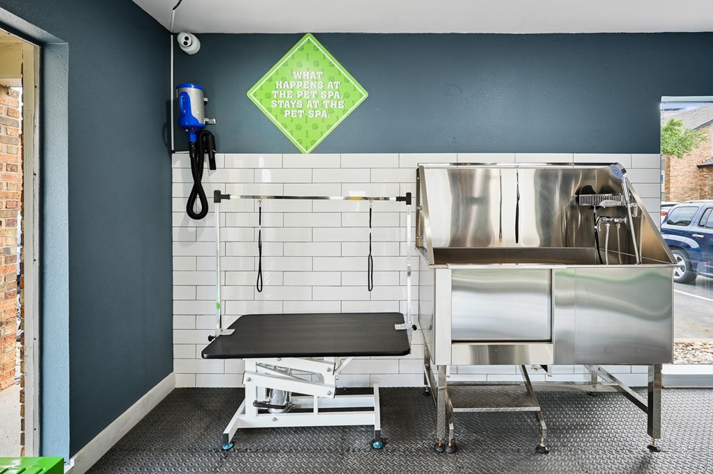 a kitchenette with a sink and a stretcher