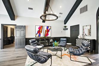 a living room filled with furniture and a large window