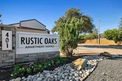 Rustic Oaks Apartments in Wylie, Tx property sign