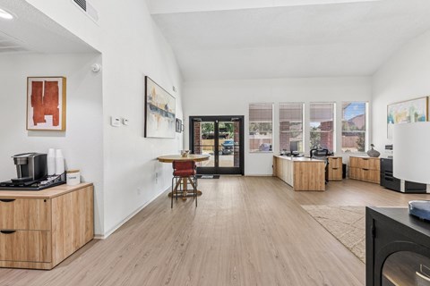 A living room with a wooden floor and a television.