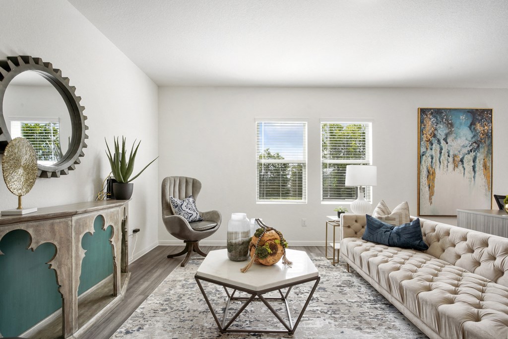 Redbud living room with plenty of natural lighting at Beacon at Ashley River Landing in Summerville, SC