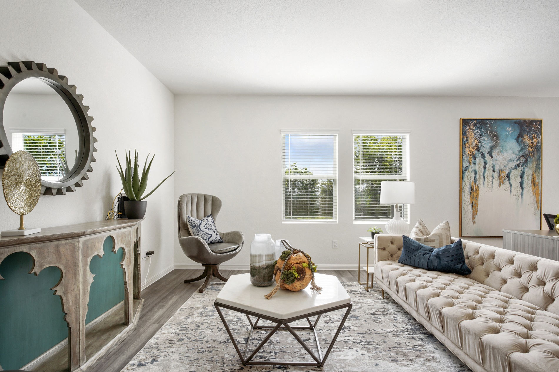 an open living room with a white couch and a table