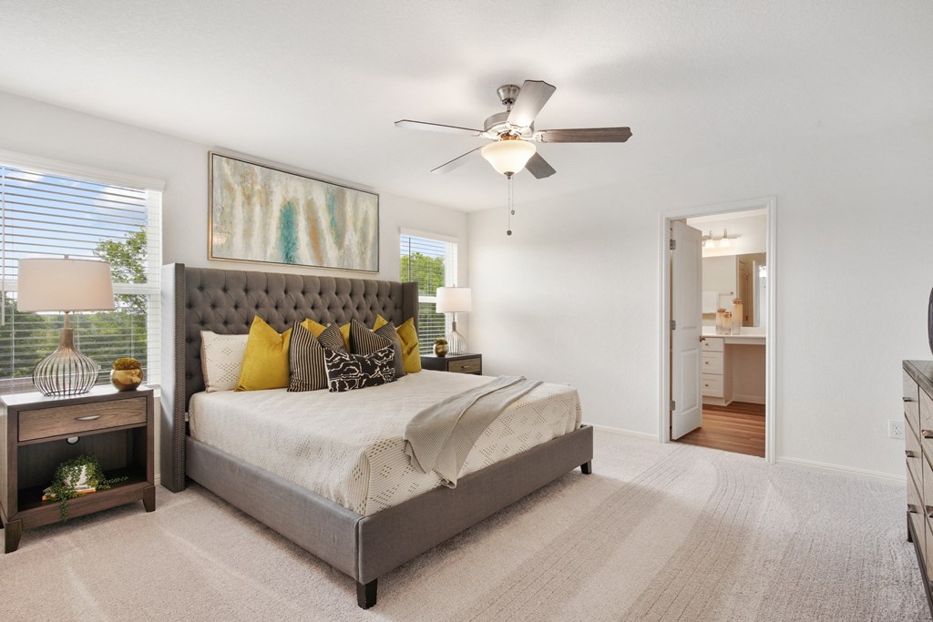 Large master bedroom with ceiling fan in Redbud floor plan at Beacon at Ashley River Landing in Summerville, SC