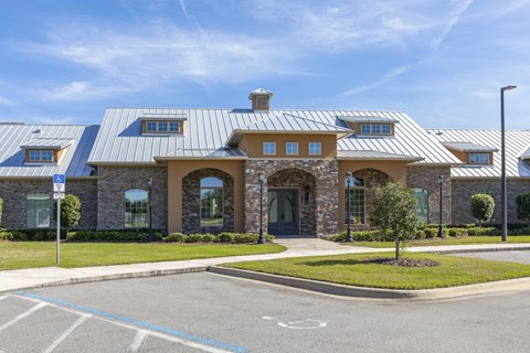 a house with a metal roof and a driveway