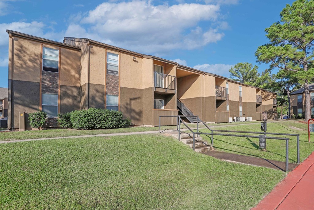 Apartment buildings with a stairway close to the playground at Stone Canyon apartments in Shreveport, LA.