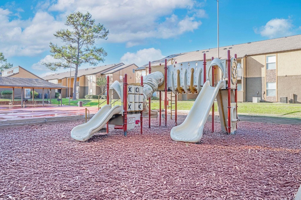 A playground with slides at Stone Canyon apartments in Shreveport, LA.