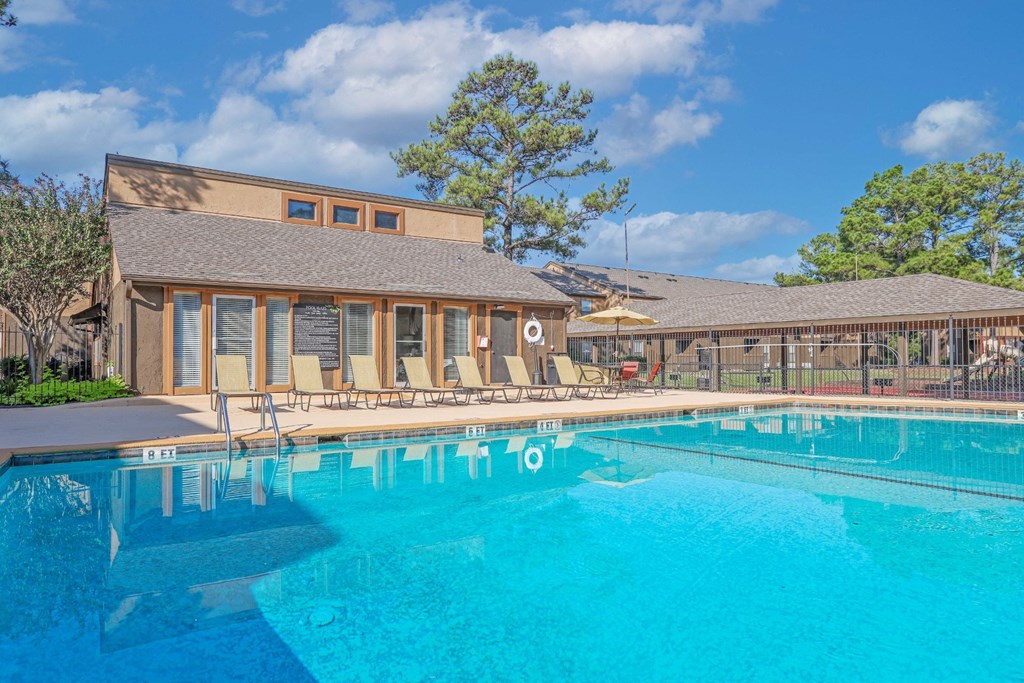 Our swimming pool with the leasing office in the background at Stone Canyon apartments in Shreveport, LA.