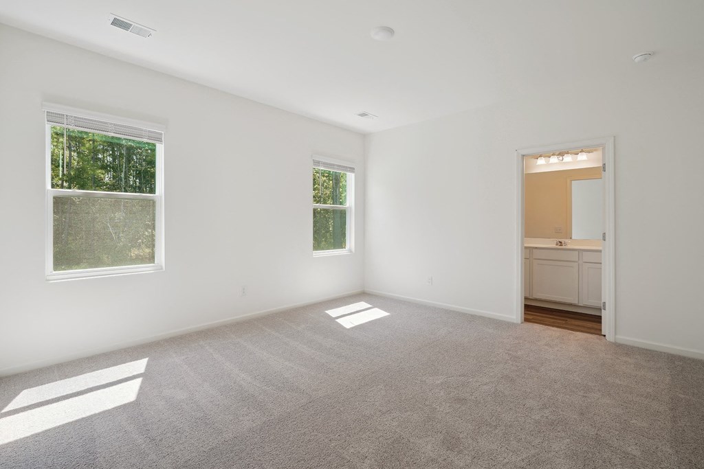 Sequoia master bedroom with two windows at Beacon at Ashley River Landing in Summerville, SC