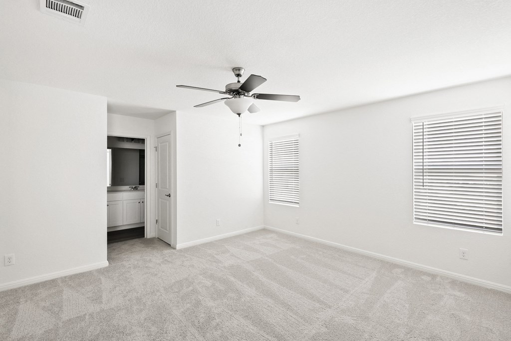 Sycamore master bedroom with doorway into bathroom at Beacon at Ashley River Landing in Summerville, SC