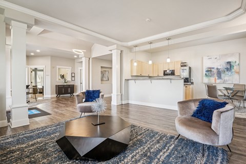 A modern living room with a black coffee table and a grey armchair.