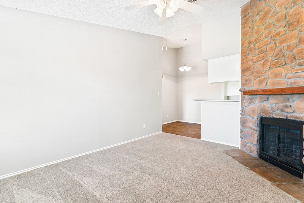 Living Room at Terrace at Bookstone and Terrace Apartments in Irving, Texas