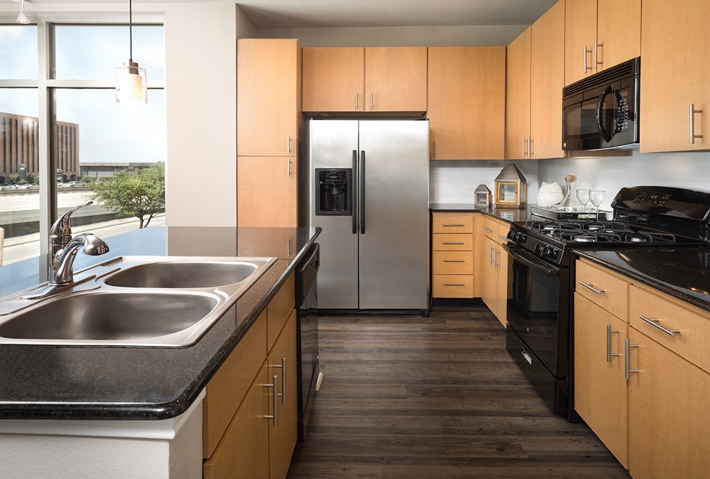 Kitchen with Modern Appliances at The Grand at Upper Kirby | Apartments in Houston, TX