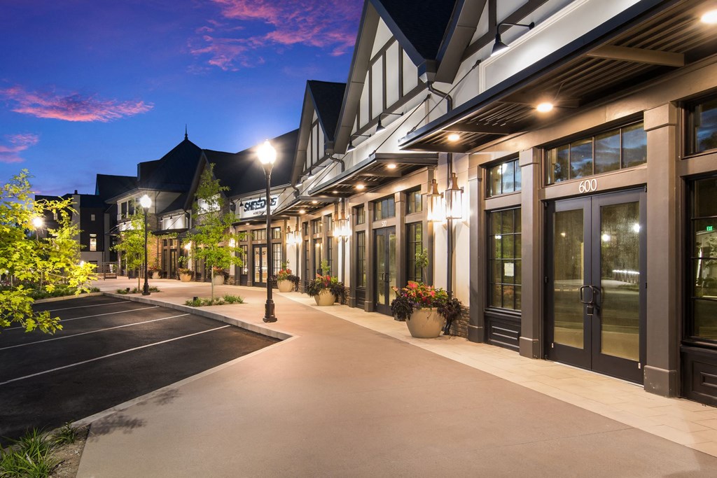 side view of the building at twilight at The Alastair at Aria Village Apartment Homes in Sandy Springs, Georgia, GA
