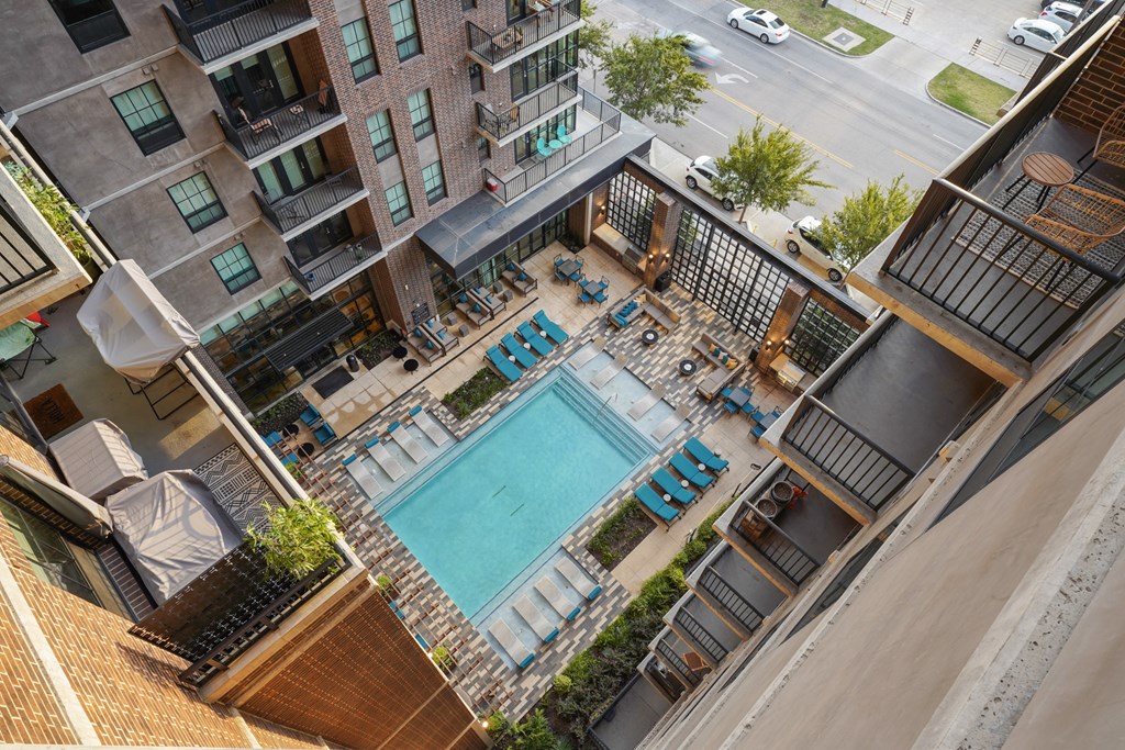 an aerial view of an apartment building with a pool at The Case Building in Dallas, TX