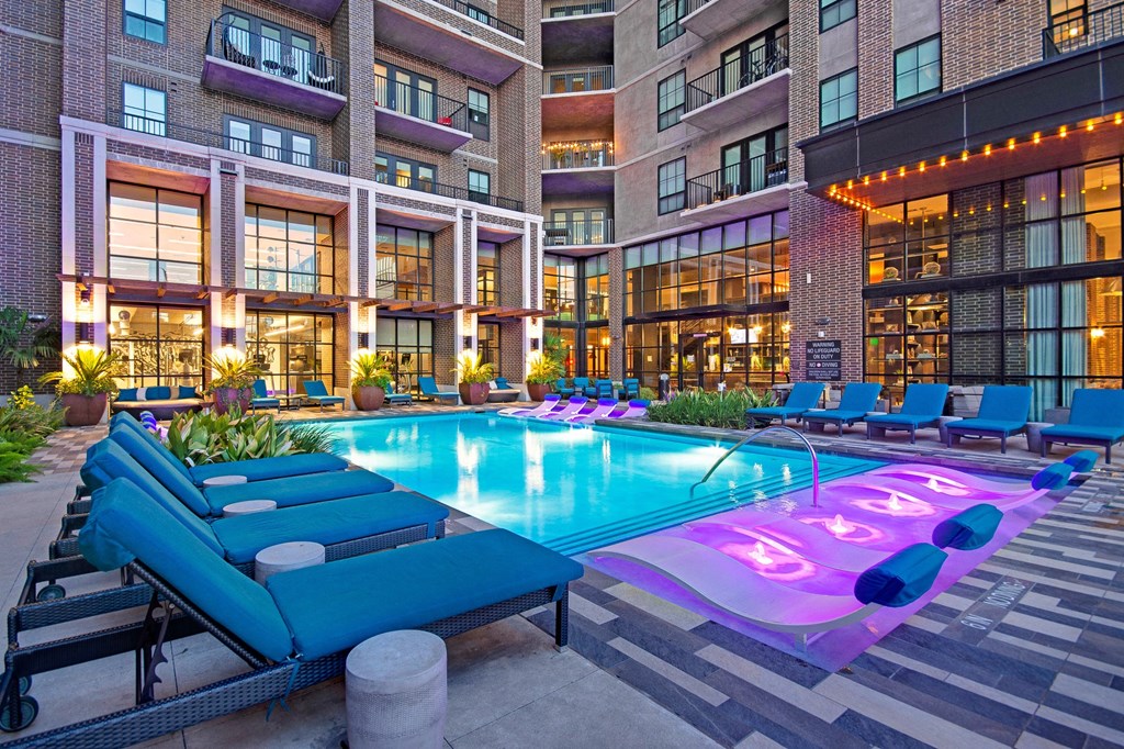 The Case Building Luxury Apartments in Deep Ellum, poolside at twilight