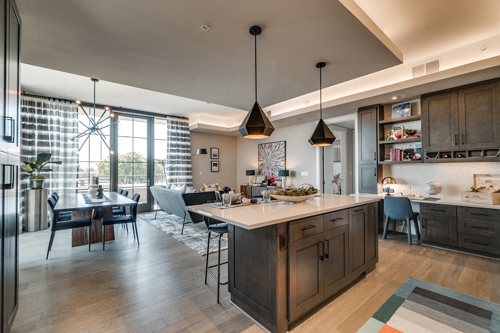 Fitted Kitchen With Island Dining at The Hamilton, Dallas, Texas