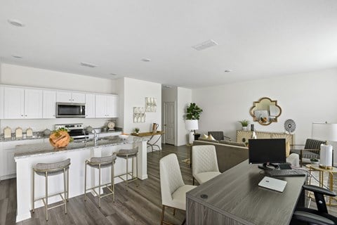 our apartments offer a living room with a kitchen and dining area at Beacon at Vine Creek, Pflugerville, TX