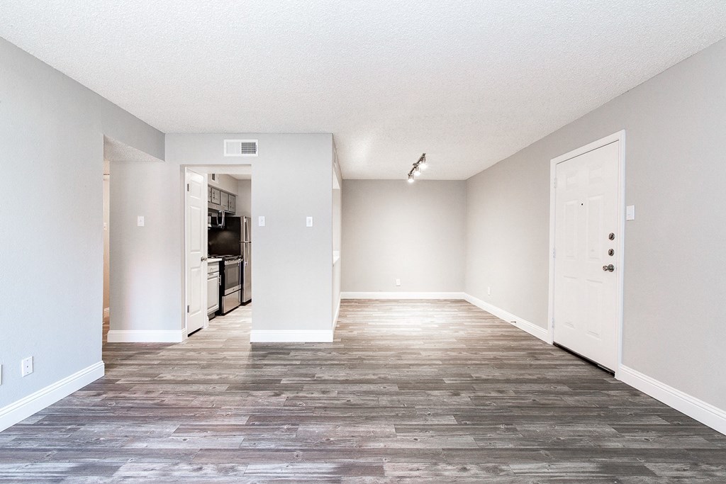 A2 upgraded apartment view of kitchen and dining room and the entrance to the apartment at Vine Apartments in Arlington, TX