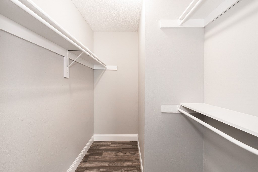 A2 upgraded apartment walk-in closet with shelving at Vine Apartments in Arlington, TX