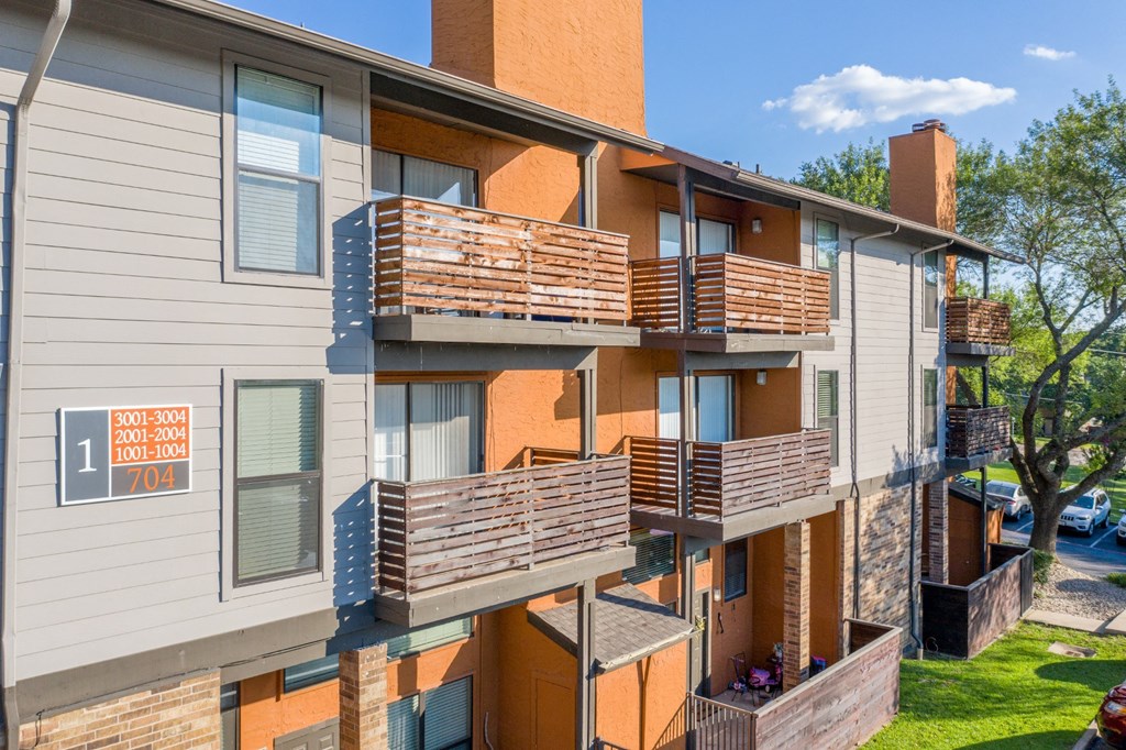 Apartment building with balconies at Vine Apartments in Arlington, TX
