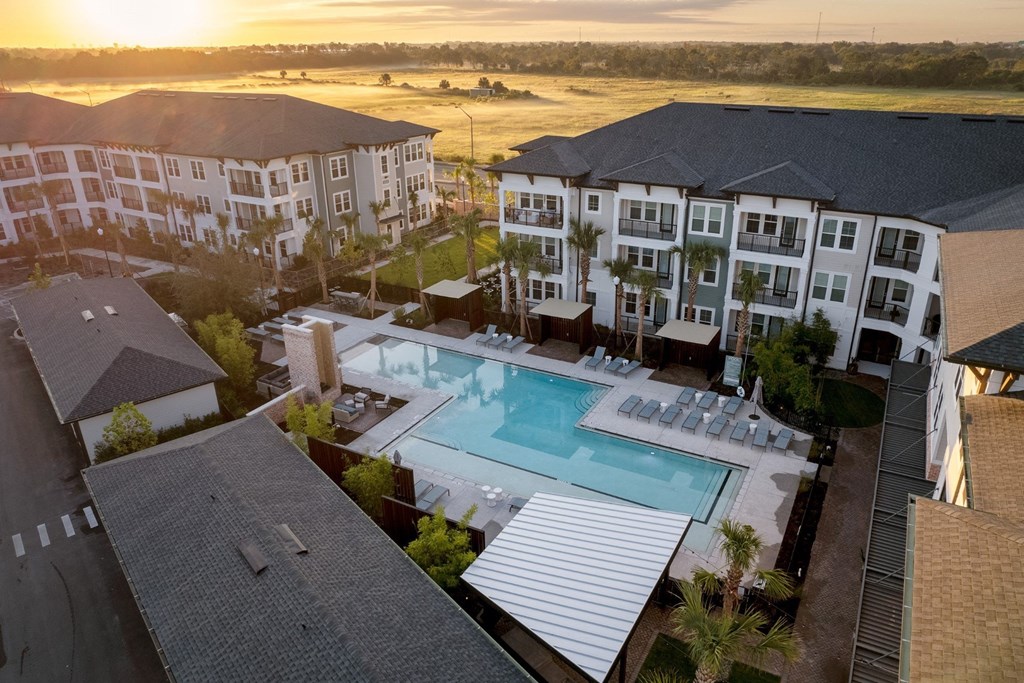 An aerial view of Vida Winter Garden Apartment with a swimming pool