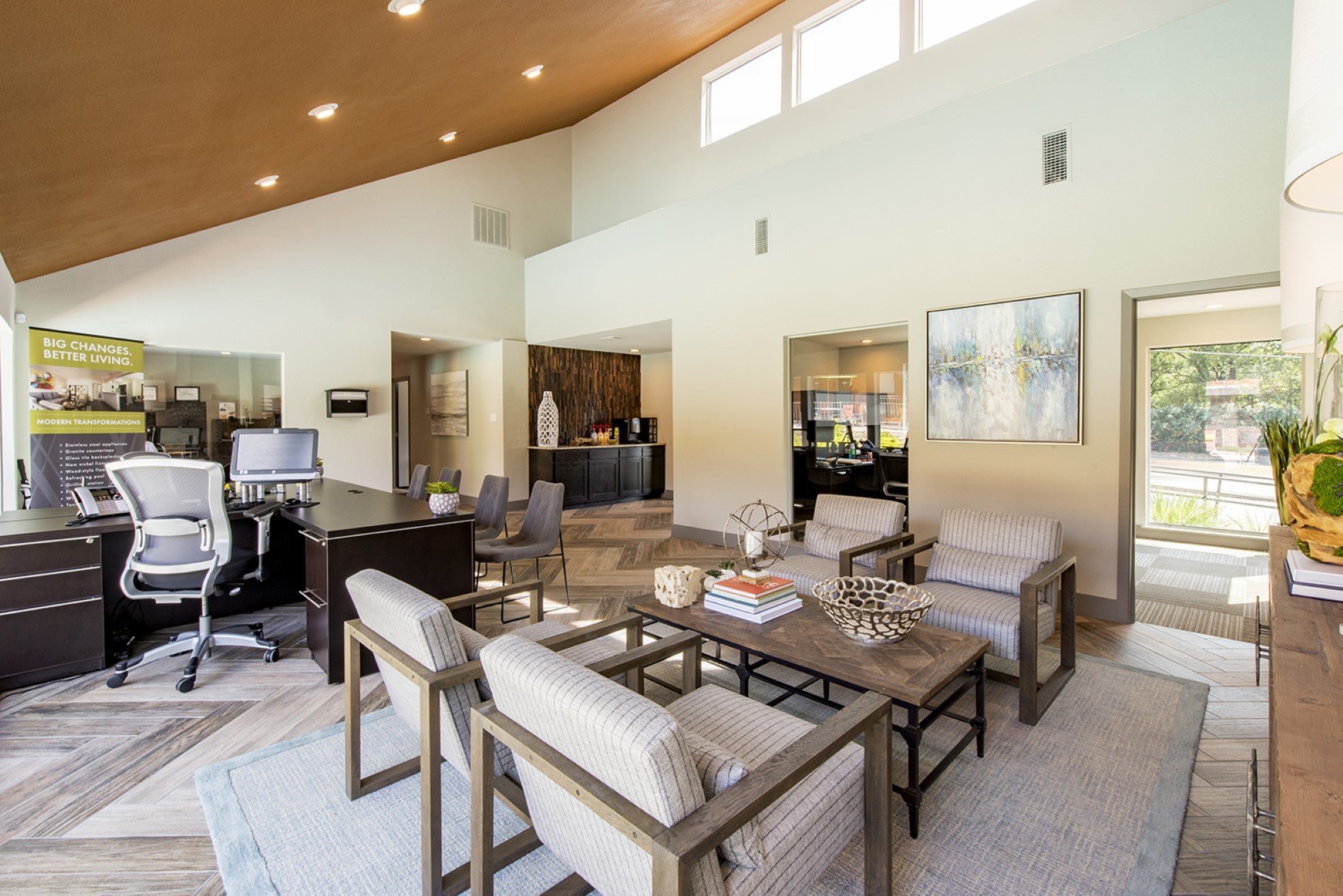 a living room with couches and chairs and a dining table