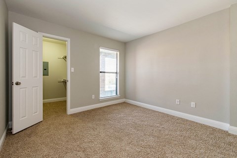 an empty bedroom of Vine apartment in Arlington, TX