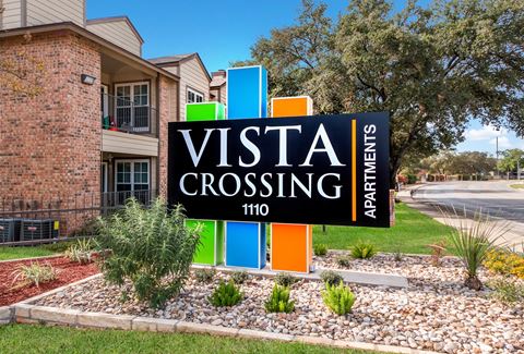 a visit crossing sign in front of a building