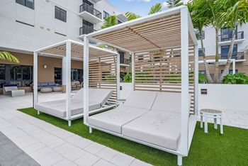 an outdoor seating area at Westgate on University in Lauderhill, FL