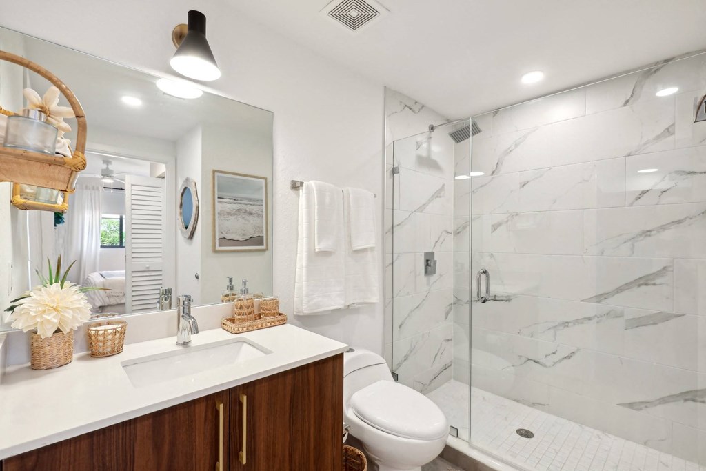 Bathroom with walk-in shower in B1 Floor Plan at Westgate on University in Lauderhill, FL
