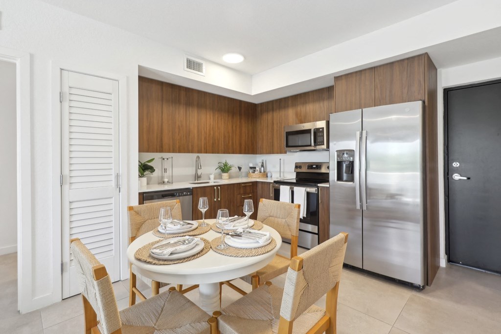 Kitchen in B1 Floor Plan with dining table at Westgate on University in Lauderhill, FL