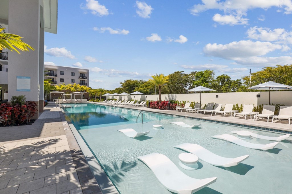 Resort-Inspired Pool with Cabanas and In-Pool Seating at Westgate on University in Lauderhill, FL