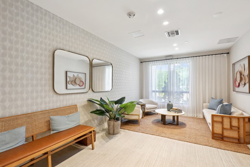 Zen Suites benches and couches in the waiting area at Westgate on University in Lauderhill, FL