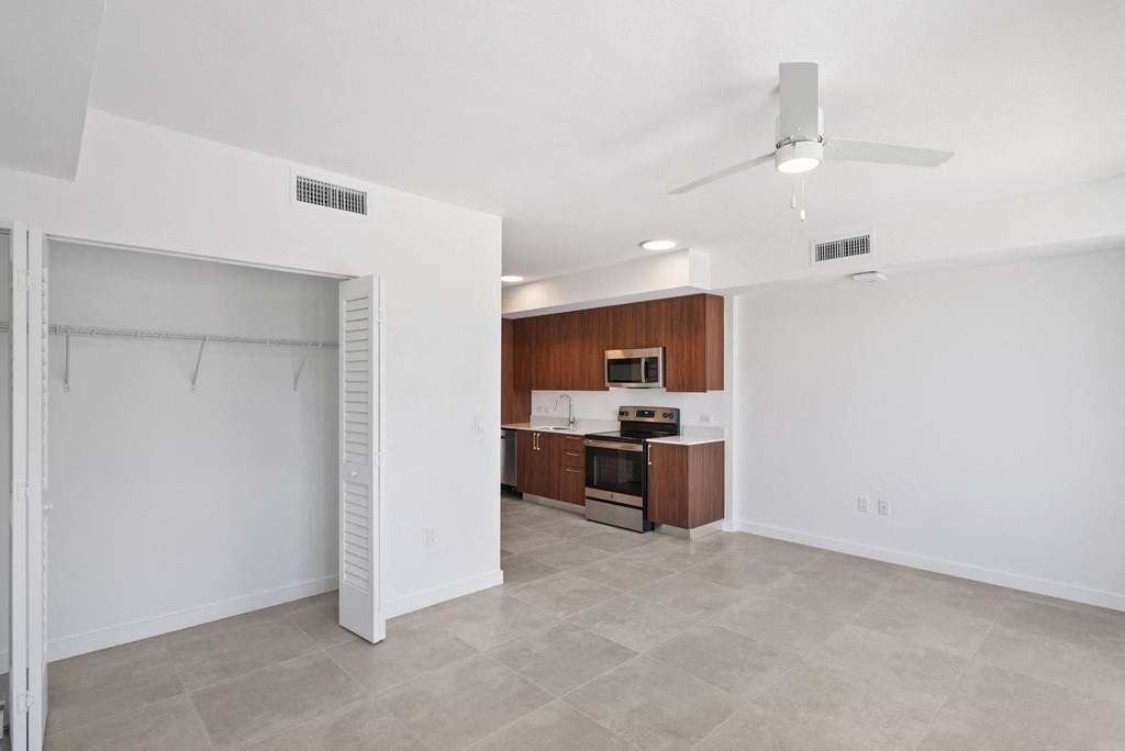 an open living space with kitchen and a loset at Westgate on University in Lauderhil, Fl