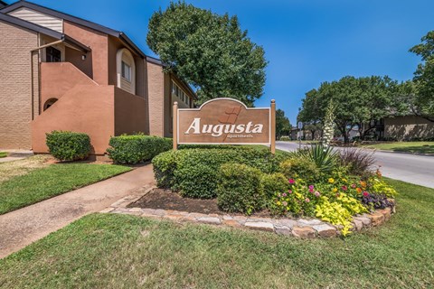 A sign that says Augusta in front of a building.
