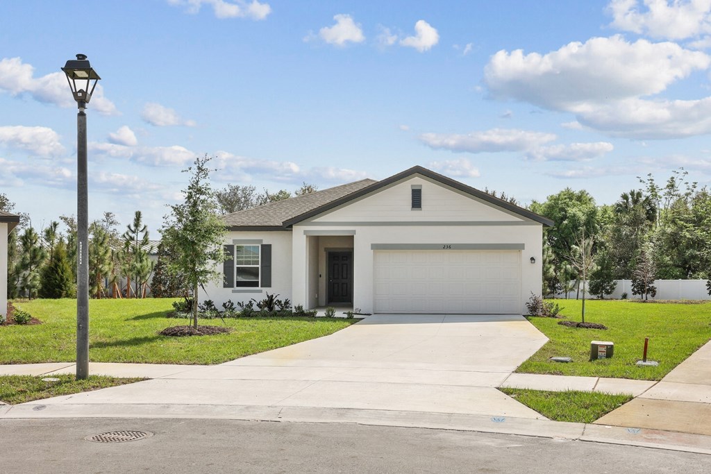 a house with a street light in front of it at Beacon at Woodland Village, DeLand, 32724