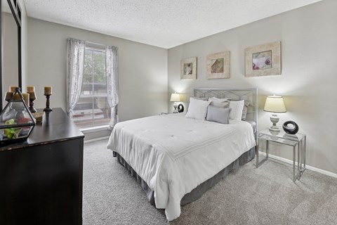 B1 second bedroom with white bed at Westdale Pointe in Austin, TX