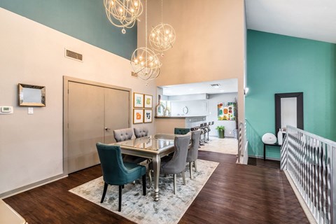 a dining room with a table and chairs