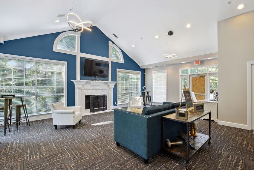 a living room with a blue wall and a fireplace