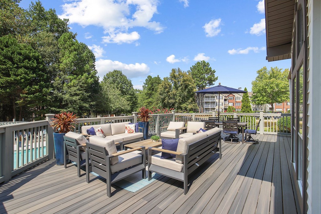 Clubhouse upstairs patio with couches and chairs at Wellington Ridge in Lawrenceville, GA
